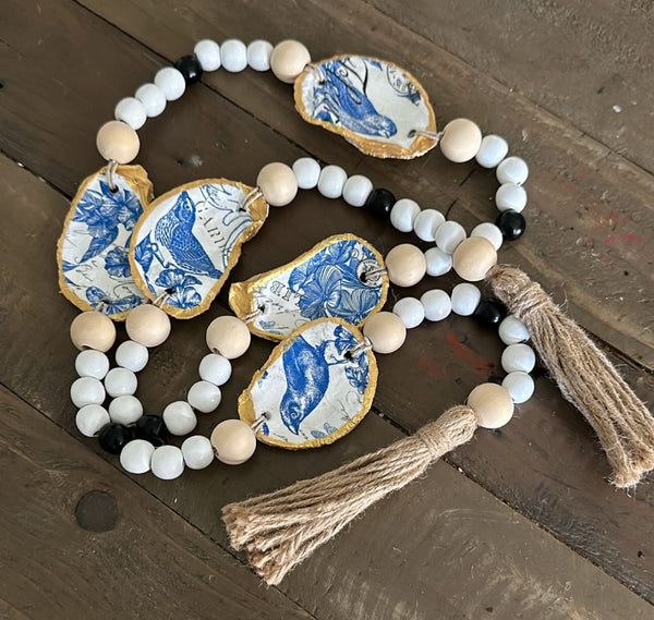 Garland- oyster shell- blue bird/floral