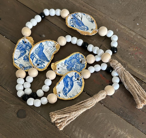 Garland- oyster shell- blue bird/floral