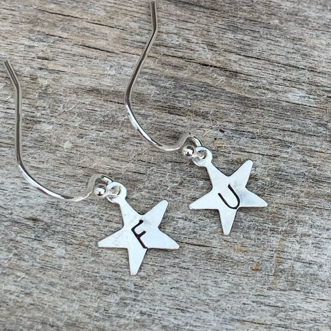 Pair of tiny sterling silver earrings - star shape - “ F U”